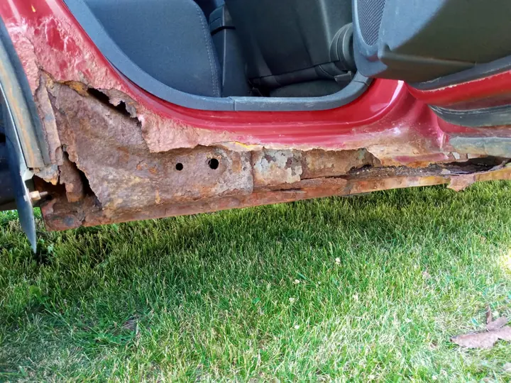 Before: wide view of corrosion damage.