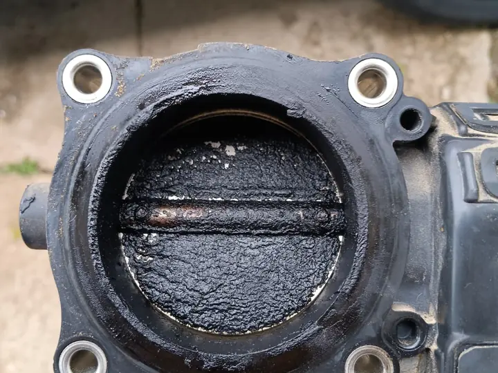 Intake-related component before service.